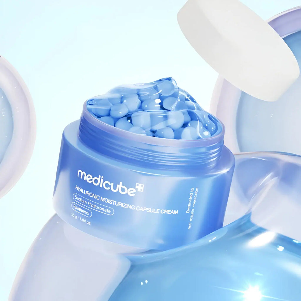 Medicube Hyaluronic Moisturizing Capsule Cream open jar showing blue hydration capsules